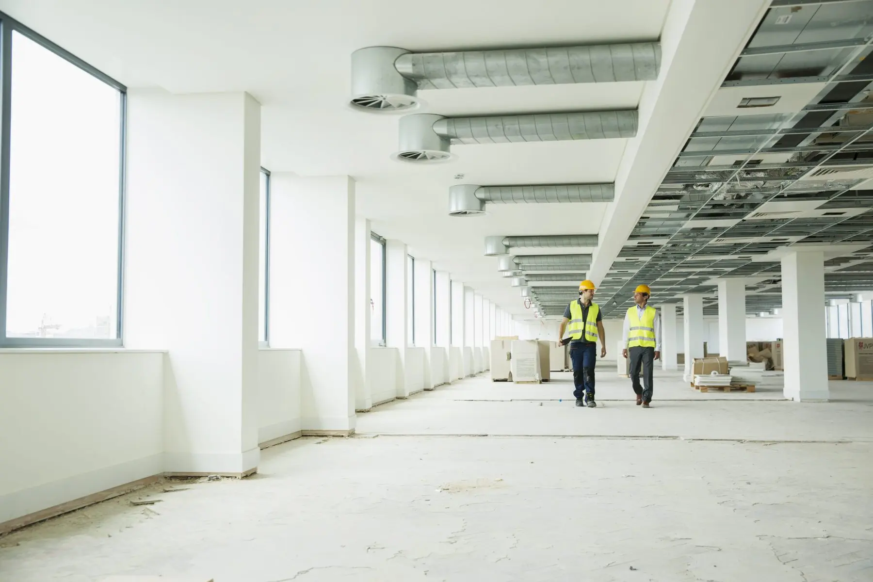 Welgo Builders site team walking through a commercial building conversion in Manchester